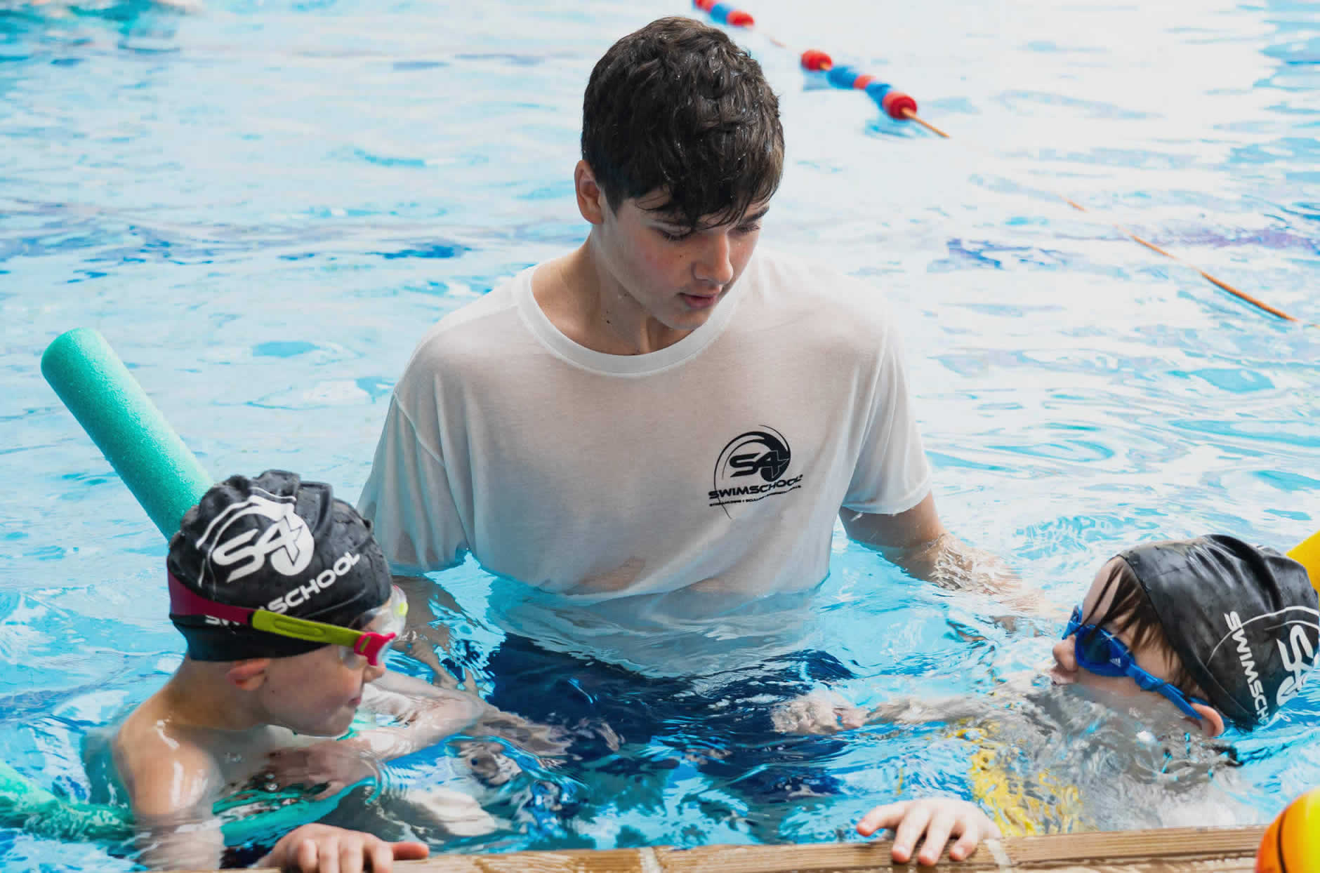 An image of an S4 instructor teaching swimmers in the pool.